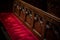 Vignette Church Pew with Red Velvet Cushion and Wooden Carvings
