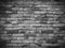 Vignetting Weathered texture of stained old black and white brick wall background, grungy rusty blocks of stone work