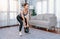 Vigorous energetic woman with dumbbell weight exercise at home.