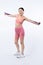 Vigorous energetic woman in sportswear portrait stretching resistance band.