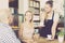 vigorous waiter girl brought cup of coffee for couple of different aged people