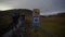 VIK, ICELAND, OCTOBER 10, 2019 A tourist group ascends a steep climb uphill during a strong wind