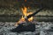 Viking ax. An ax driven into a piece of wood. Ax in the water. An ax by the fire