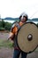 Viking posing in armor with shield and sword