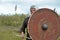 Viking warrior with spear and shield on the attack