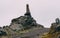 Viking wood statue standing on a rock in iceland