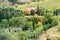 Villa with cypresses in vineyard in Tuscany, Italy