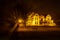 Villa Rams Woerthe  on a misty evening with yellow light shining trough the trees  in the Netherlands