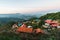 Village amid layers of mountains with sunlight and fog in the evening that view from the Akha village of Maejantai on the hill