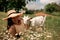 Village animals. Happy pregnant woman hugs goat, concept of unity of nature and man. Life in the countryside.