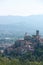 Village of Arcola with the pentagonal tower and in the background the valley of the Magra river and the Apuane