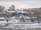 Village on the banks of the river on a winter morning