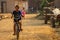 Village child driving a bicycle Laos