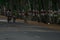 Village Children enjoying bike ride on an empty countryside road in India