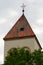 Village church in Baden Wuerttemberg, Pforzheim, Germany, a steeple and slate roof, cloudy sky