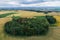 Village country farming shapes in field aerial drone photo