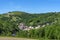 The village of Courzieu in the landscape of the Lyonnais mountains in spring in France