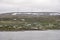 Village and electric wind mills on Barents sea,  Batsfjord, Norway