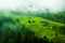 Village farm under a mist in Switzerland.