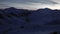 Village Houses in Snowy Valley at Night Sunrise