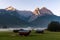 Village huts on foggy mountain meadow