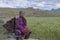 Village Lady preparing for work in fields in Kibber Village,Spiti Valley,Himachal Pradesh,India