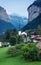 The village of Lauterbrunner in Switzerland. Vertical panorama. Mountain valley in summer time.