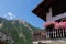 Village of Lillaz in Cogne in the Aosta Valley in the Italian Alps Mountains - Balcony of a Mountain House with Pink Flowers -