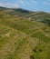 Village in the mountain with wind turbine or windmill providing renewable energy