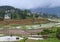 Village over terraced rice fields in Yunnan, China