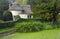 Village pond and thatched cottage Northill Bedfordshire.