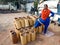 village poor woman standing at wooden art workshop with strong attitude in India January 2020