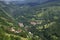 Village with red roofed houses in the wooded mountains in Kosovo