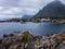 A village on the rocky shore of the fjord in Norway