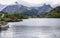 A village on the rocky shore of the fjord in Norway