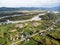 Village in Russia, Altai Mountains, houses and Katun River. Top view of mountain river in the Altai mountains and the village of