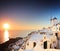 Village on Santorini island and a sunset