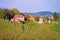 Village at Slovenian heart shape wine road among vineyards