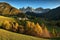 Village St. Magdalena in front of the Geisler or Odle Dolomites mountain peaks. Val di Funes valley in Italy.