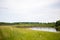 The village stands on a hill near the Tara river, Omsk region, Siberia. Private homes, rural area near the reservoir, on a cliff.