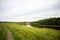 The village stands on a hill near the Tara river, Omsk region, Siberia. Private homes, rural area near the reservoir, on a cliff.