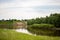 The village stands on a hill near the Tara river, Omsk region, Siberia. Private homes, rural area near the reservoir, on a cliff.