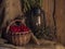 Village still life. Retro kerosene lamp, basket, viburnum berries, dried oregano and mint on shabby sack