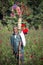 A village street hawker Kohinur age 68, selling colorful paper flowers, Dhaka, Bangladesh.