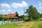 Village street in summer. Beautiful log house. Village of Visim, Sverdlovsk region, Russia