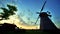 Village sunrise timelapse. Rural windmill silhouette. Sunrise landscape