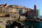 Village of Tellaro di Lerici near the Cinque Terre. View of the village illuminated by the light of the sunset. Houses, church