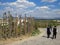 Village Uchisar. Sign of the Pigeon Valley. Three men in black suits and white shirts are walking along the road