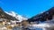 Village under the snowy alpine hills.