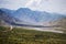 Village in valley in the foothills of the Fann mountains. Landscape. Toned